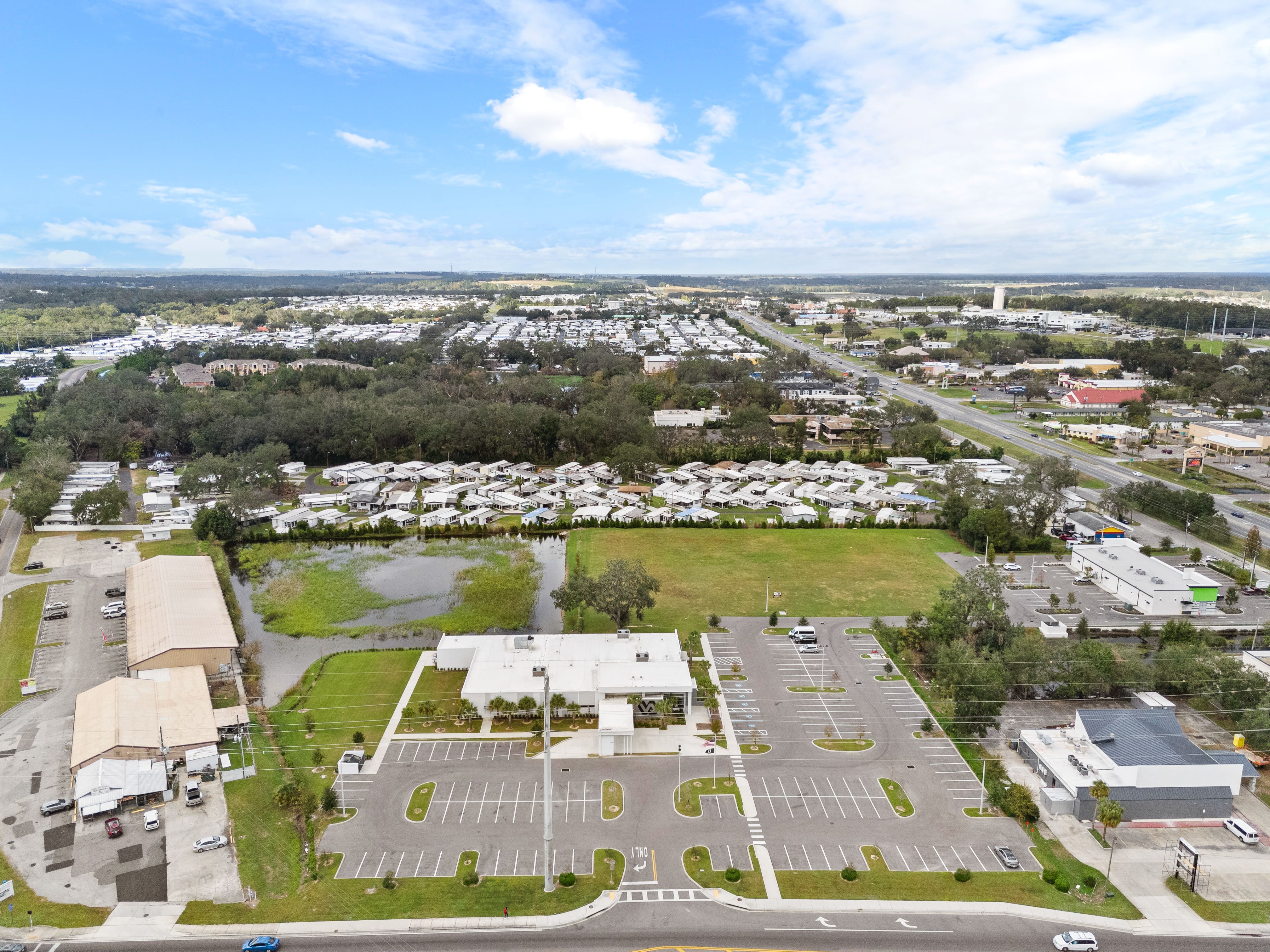 Wide overhead view of Zephyrhills VA Clinic and surrounding land, captured from a direct aerial perspective